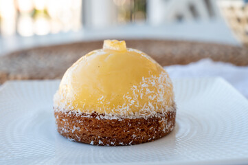 Small yellow  lemon ball tart from French pastry shop