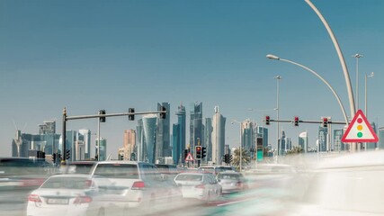 Poster - Doha skyline and traffic jam on the intersection timelapse as viewed from corniche in Doha, Qatar, Middle East. Cars in front of traffic lights