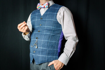 Wall Mural - Portrait of Man in Tweed Vest and Colorful Bow Tie. Successful Man Standing Proudly. Vintage Style and Dress.