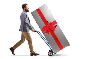 Poster - Bearded man pushing a hand truck with a fridge tied with a red ribbon