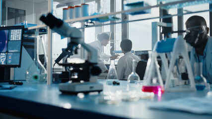 Wall Mural - medical science laboratory with diverse multi-ethnic team of biotechnology scientists developing dru