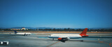 Fototapeta Natura - Planes ready for take off at Los Angeles airport.