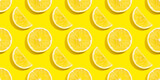 Seamless pattern of lemon slices on a yellow background.