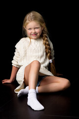 Wall Mural - Portrait of beautiful girl sitting on the floor