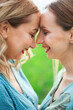 © vadik02020 - Best friends. The two friends laugh. The two girls are happy. Friends have fun. The girl touched her forehead to the other girl. The two foreheads touch.