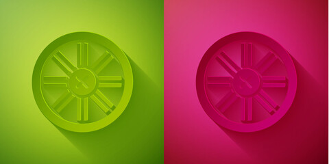 Wall Mural - Paper cut Old wooden wheel icon isolated on green and pink background. Paper art style. Vector.