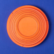 Clay Target For Skeet Shooting Against The Blue Background