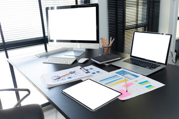 Workspace with desktop computer, office supplies,  at home or studio. Blank screen for graphics display montage.