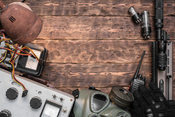 Wall Mural - Post apocalypse soldier equipment on the table flat lay concept background with copy space.