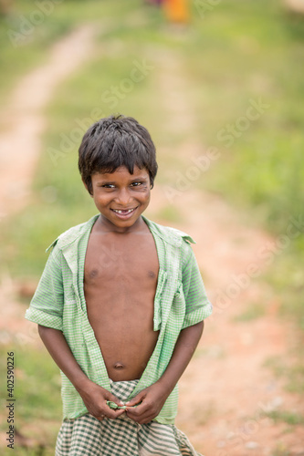 Plakat Poor Indian boy in country road side, Tamilnadu, India.