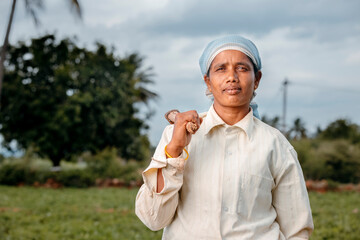 Indian women farmer portrait on farm field.