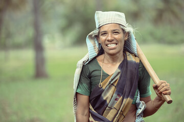 Indian women farmer portrait on farm field.