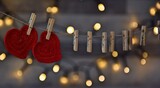 Fototapeta  - Czerwone serduszka na sznurze przypięte spinaczami vintage background Valentine's day, romantyczne tło