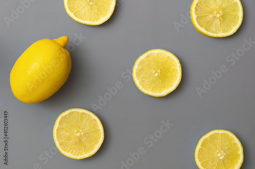 yellow-lemons-on-gray-background-colors-of-the-year-2021-pantone-illuminating-and-ultimate-gray-flat-lay