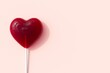 Red Heart Shape of lollipop Candy on Pink background for copy space. 3D Render. Minimal Valentine Concept Idea.