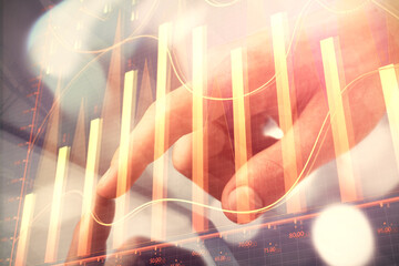 Fototapete - Multi exposure of man's hands holding and using a phone and financial chart drawing. Market analysis concept.
