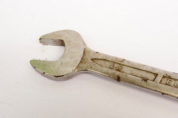 old rusty wrench on a white background