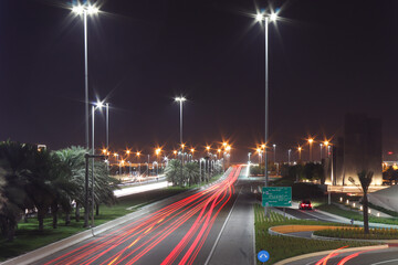 Wall Mural - Abu Dhabi city Night traffic as light trails