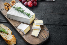 Delicious Brie Cheese, On Black Wooden Table  With Copy Space For Text