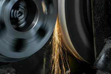 Wall Mural - External grinding of a cylindrical shaft on a cylindrical grinding machine.