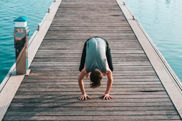 Bakasana or Crane Pose you keep in balance on your hands and with your legs touching your arms, yoga.