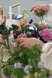 florist making a bouquet of flowers