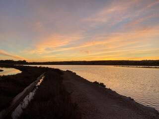 Sunset rural farm and salt lake meadow horizon view