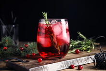 Tasty Refreshing Cranberry Cocktail With Rosemary On Wooden Table