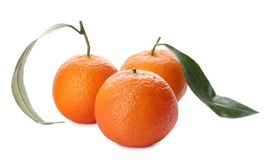 Whole fresh tangerines with green leaves on white background