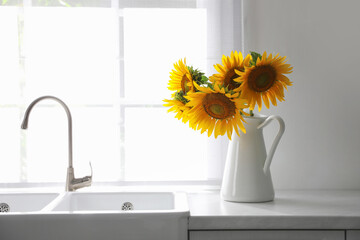 Sticker - Bouquet of beautiful sunflowers on counter in kitchen