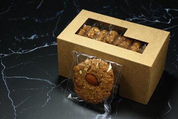 Classic traditional baked cookie topping with almond in the plastic bag. Mock up of sweet dessert concept. 