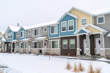 Wall Mural - Two storey apartments on a beautiful residential landscape with snow in winter