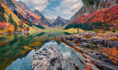 Wall Mural - landscape photography. attractive morning view of swiss alps. santis peak reflected in the calm surf