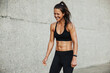 © Jacob Lund - Sporty woman smiling during workout