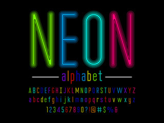 Wall Mural - Glowing neon light alphabet design with uppercase, lowercase, numbers and symbol