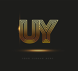 Initial Logo Letter UY, Bold Logotype Company Name Colored Gold, Elegant Design. isolated on black background.