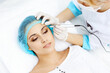 © rogerphoto - Professional beautician doing eyebrow tattoo at woman face. Permanent brow makeup in beauty salon, closeup. Cosmetology treatment