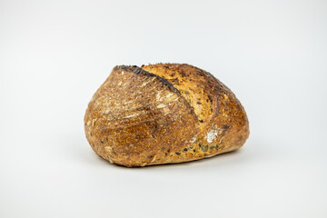 Photo of a homemade bread with seeds on a white background