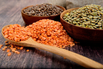 Wall Mural - Organic Lentils in a wooden bowls