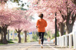 © torwaiphoto - Asian woman exercise in the morning She is running at Sakura Park.