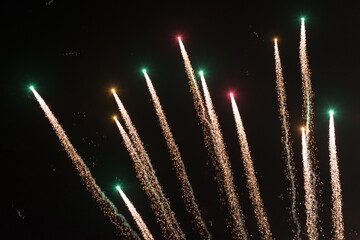 background of fireworks exploding in the sky at night to celebrate holiday