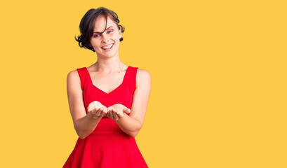 Sticker - Beautiful young woman with short hair wearing casual style with sleeveless shirt smiling with hands palms together receiving or giving gesture. hold and protection