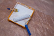 © branislav - Painting equipment on a floor covered with protecting sheet: a paint tray with white paint, a paint roller and a paintbrush