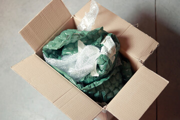 cardboard box with bubble wrap inside