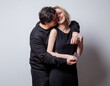 © Masson - Caucasian heterosexual man and woman in black clothes on white background