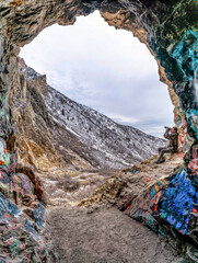 Canvas Print - Photographer under natural stone arch formation in scenic Provo canyon Utah