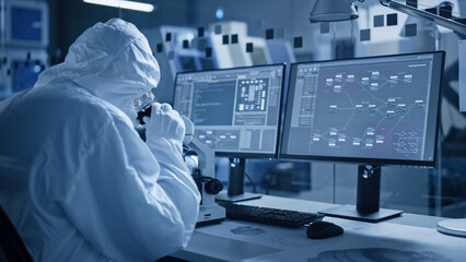 Wall Mural - Research Factory Cleanroom: Engineer / Scientist wearing Coverall and Gloves Use Microscope to Inspect Motherboard Microprocessor Component, Developing High Tech Modern Electronics