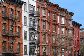 Wall Mural - Old New York apartment buildings with ornate roof line cornice and exterior fire escape ladder