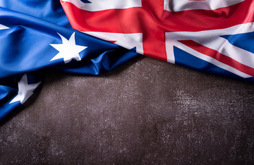 Wall Mural - Happy Australia day concept. Australian flag against old stone background. 26 January.