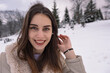 © Ahmed - Happy young woman enjoying winter time outdoor
